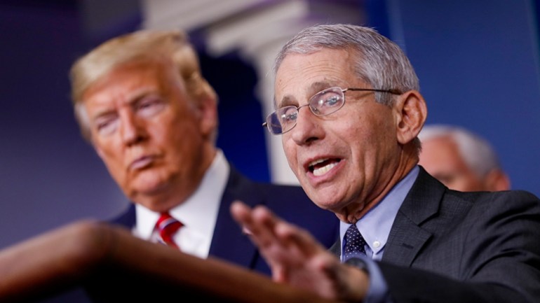 epa08310093 Director of the National Institute of Allergy and Infectious Diseases Anthony Fauci (R) speaks as US President Donald Trump (L) listens during a Coronavirus Task Force news conference in t