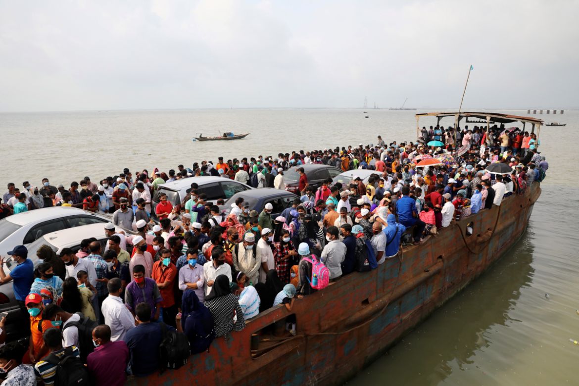 Migrant people are seen on board of an overcrowded ferry, as they go home to celebrate Eid al-Fitr, amid concerns over the coronavirus disease (COVID-19) outbreak, in Munshiganj, Bangladesh, May 23, 2
