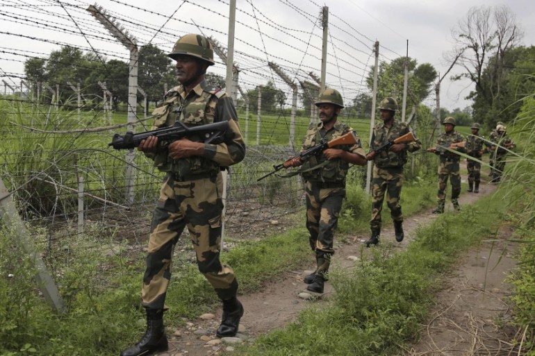 In this Tuesday, Aug. 13, 2019 file photo, India''s Border Security Force (BSF) soldiers patrol near the India Pakistan border fencing at Garkhal in Akhnoor, about 35 kilometers (22 miles) west of Jamm