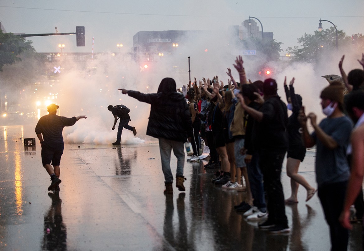Tear gas is fired as protesters clash with police while demonstrating against the death of George Floyd outside the 3rd Precinct Police Precinct on May 26, 2020 in Minneapolis, Minnesota. Four Minneap