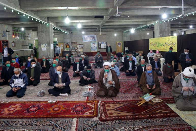 Re-opening of mosques to prayers in white regions of Iran- - ABYEK, IRAN - MAY 07: People perform a prayer in accordance with social distancing at Imam Sadiq Mosque after Iranian government announced