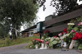 Flowers dedicated to the late step-sister of Philip Manshaus, who killed her and attacked al-Noor mosque, are seen outside their house in Baerum, Norway on August 12, 2019 [File: Reuters/Orn Borgen]
