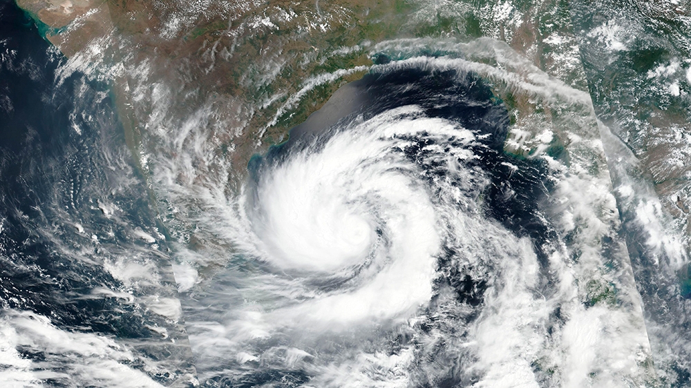 This May 17, 2020 satellite image released by NASA shows cyclone Amphan over the Bay of Bengal in India. Amphan has intensified into a super cyclone and expected to make a landfall near Sundarbans, so