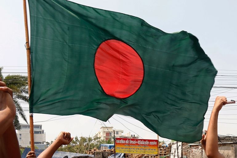 Bangladeshi students hold national flag in Dhaka, BangladeshEPA-EFE/MONIRUL ALAM