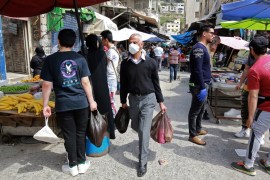 Residents shop at a market during the novel coronavirus pandemic crisis in the Jordanian capital Amman Khalil MAZRAAWI / AFP