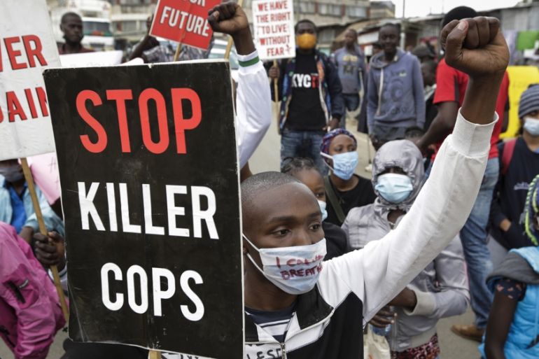 Protesters demonstrate against police brutality, in the Mathare slum, or informal settlement, of Nairobi, Kenya Monday, June 8, 2020. The protest against police brutality in Kenya was in support of th