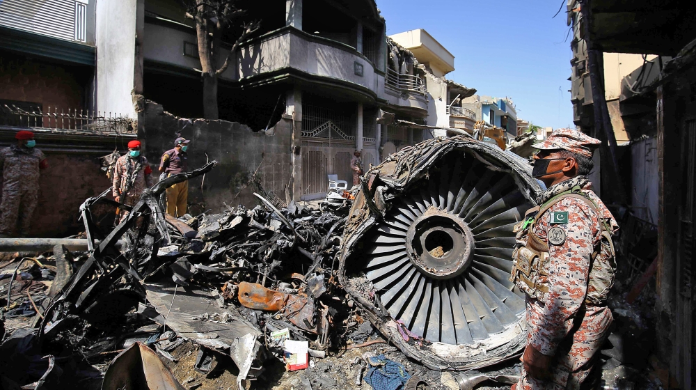 The wreckage of the passenger plane of state-run Pakistan International Airlines, at the crash scene in a residential area, in Karachi, Pakistan, 22 May 2020 after a Pakistan International Airlines pa