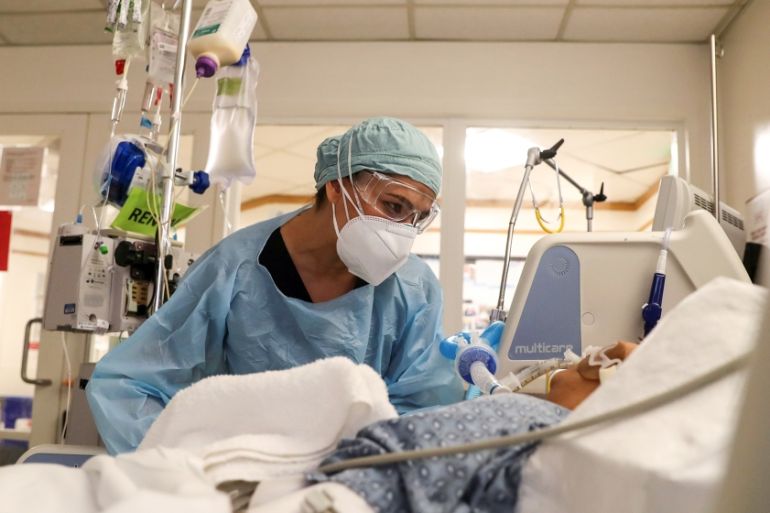 Co-director of the intensive care unit at CommonSpirit''s Dignity Health California Hospital Medical Center, Dr. Zafia Anklesaria, 35, who is seven months pregnant, attends to a COVID-19 patient in the