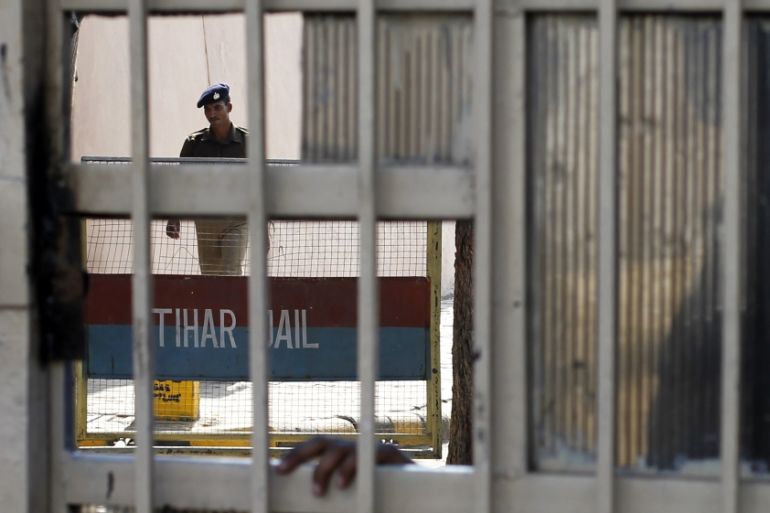 A policeman walks inside the Tihar Jail