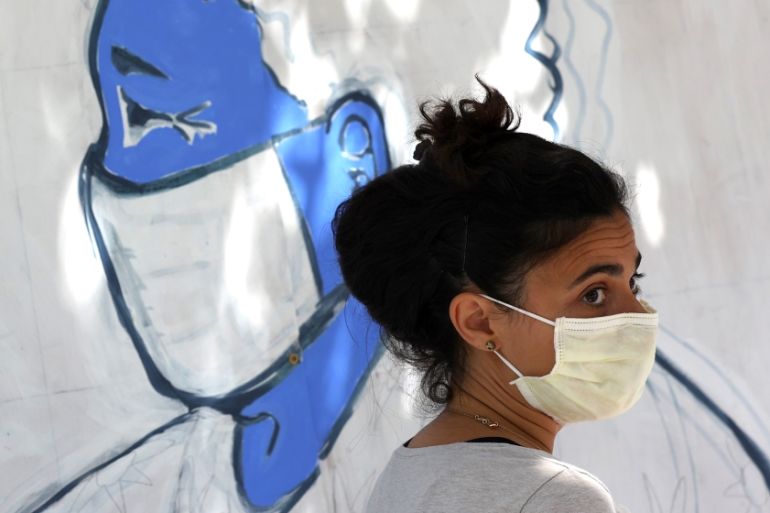 An Emergency room doctor paints a mural outside of Zuni restaurant to honor medical workers during coronavirus COVID-19 pandemic on June 22, 2020 in San Francisco, California. Doctors and medical work