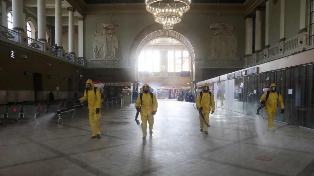 Emergencies Ministry members sanitize a railway station amid the outbreak of the coronavirus disease in Moscow