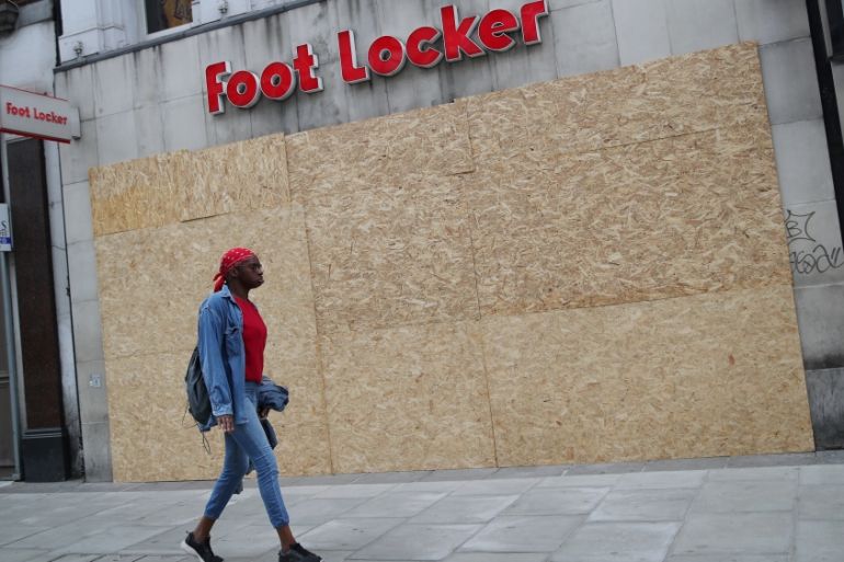 Shops are seen boarded up in Oxford Street, in London