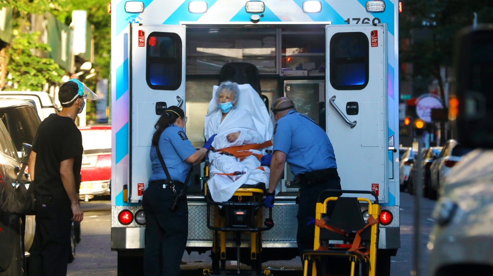 A elderly woman is transported into an ambulance on Manhattan's west side in New York, New York, USA, 22 June 2020. New York State Governor Cuomo continued to urge caution, particularly as many as 19 