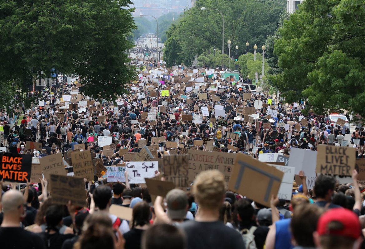 WASHINGTON, DC - JUNE 06: Demonstrators march on Constitution Avenue near the Dirksen Senate Office Building during a protest against police brutality and racism on June 6, 2020 in Washington, DC. Thi