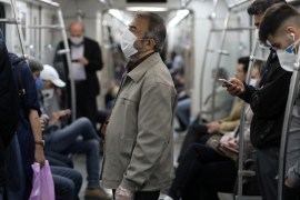 Iranians wear protective face masks, following the outbreak of the coronavirus disease (COVID-19), as they drive with the metro, in Tehran, Iran, May 20, 2020. WANA (West Asia News Agency