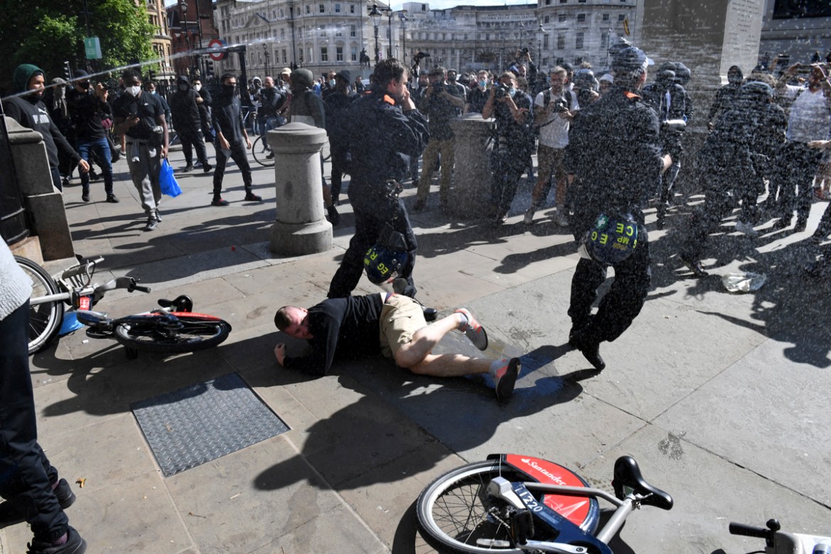 Fights take place in Trafalgar Square as protesters supporting the Black Lives Matter movement clash with opponents in central London on June 13, 2020, in the aftermath of the death of unarmed black m