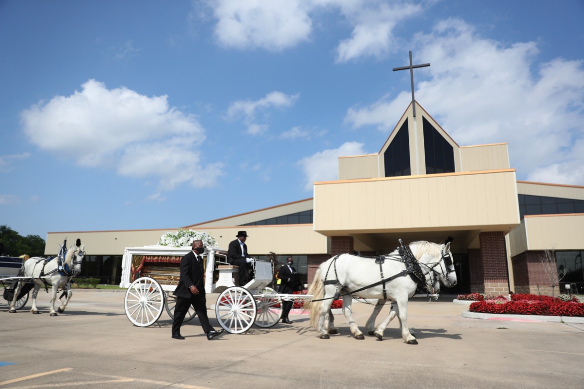 HOUSTON, TEXAS - JUNE 09: Terence Reed jr. drives his horse drawn hearse containing the remains of George Floyd to the Houston Memorial Gardens cemetery on June 9, 2020 in Houston, Texas. Floyd died M