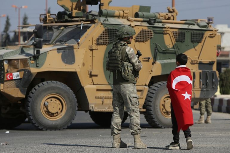 Turkish soldiers patrol the northern Syrian Kurdish town of Tal Abyad, on the border between Syria and Turkey, on October 23, 2019. - Moscow's forces in Syria headed for the border with Turkey today