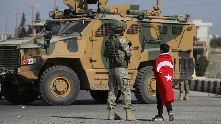 Turkish soldiers patrol the northern Syrian Kurdish town of Tal Abyad, on the border between Syria and Turkey, on October 23, 2019. - Moscow's forces in Syria headed for the border with Turkey today