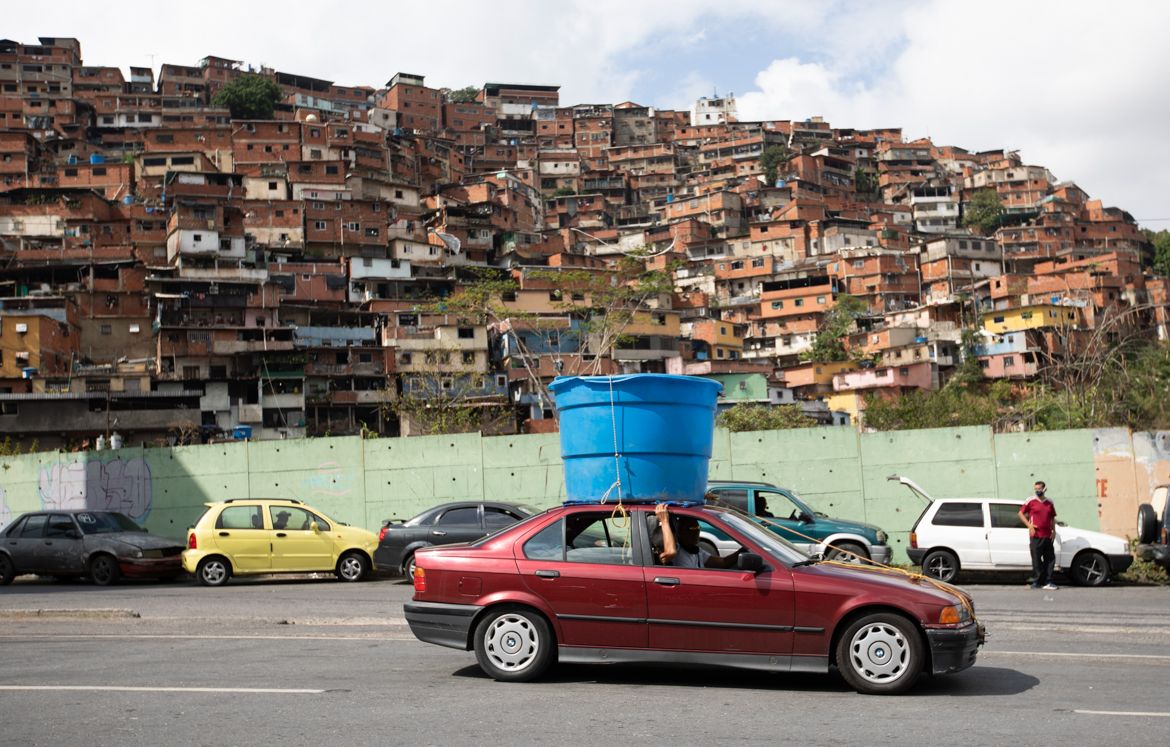 A car drives past hauling a plastic water tank on it''s rooftop, in the Petare neighborhood of Caracas, Venezuela, Friday, June 5, 2020. An estimated 86% of Venezuelans reported unreliable water servic