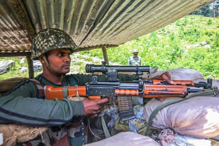 An Indian border security force soldier keeping vigil from a bunker along the Srinagar-Leh National highway on June 17, 2020.At least 20 Indian soldiers were killed in a violent clash with Chinese for