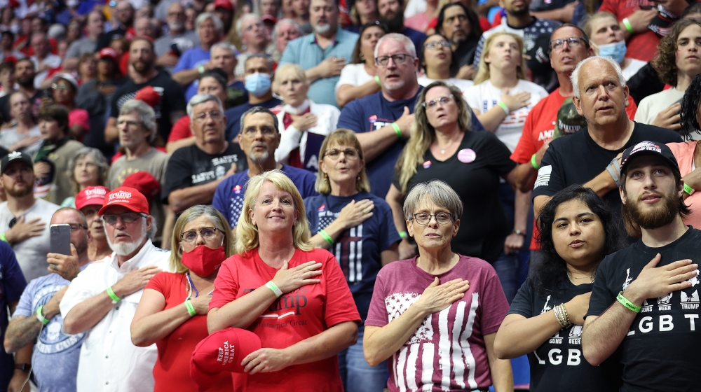 Supporters participate in the Pledge of Allegiance during a campaign rally for U.S. President Donald Trump at the BOK Center, June 20, 2020 in Tulsa, Oklahoma. Trump is holding his first political ral