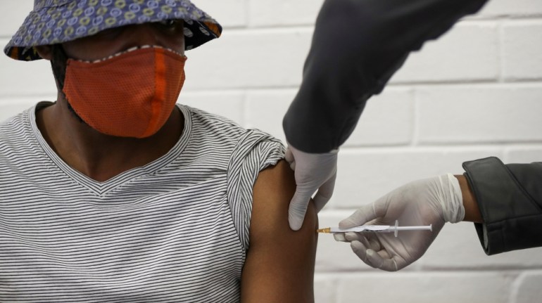 A volunteer receives an injection from a medical worker during the country''s first human clinical trial for a potential vaccine against the novel coronavirus, at Baragwanath Hospital in Soweto, South
