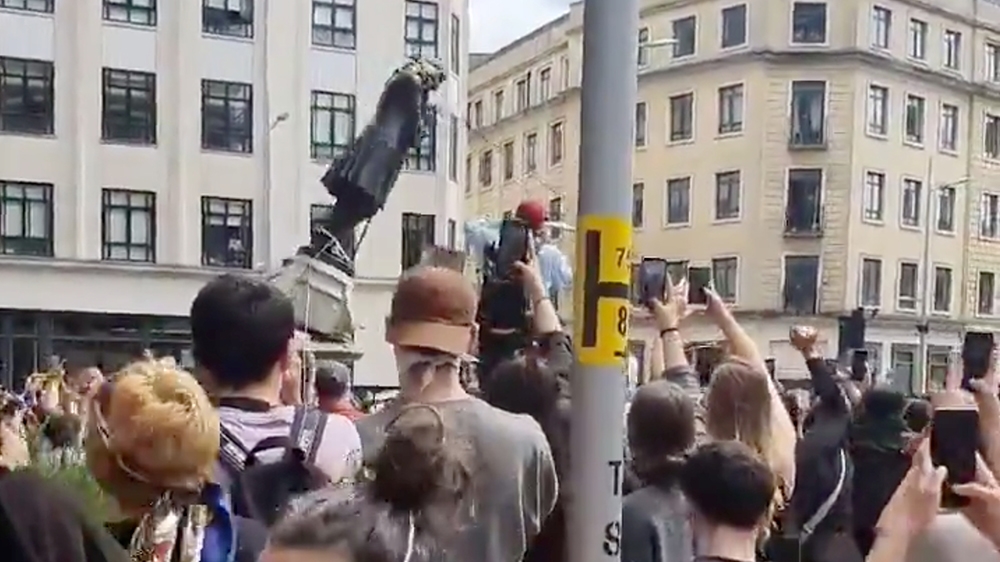 Protesters tear down a statue of Edward Colston during a protest against racial inequality in Bristol, Britain June 7, 2020 in this screen grab obtained from a social media video. Mohiudin Malik/via R