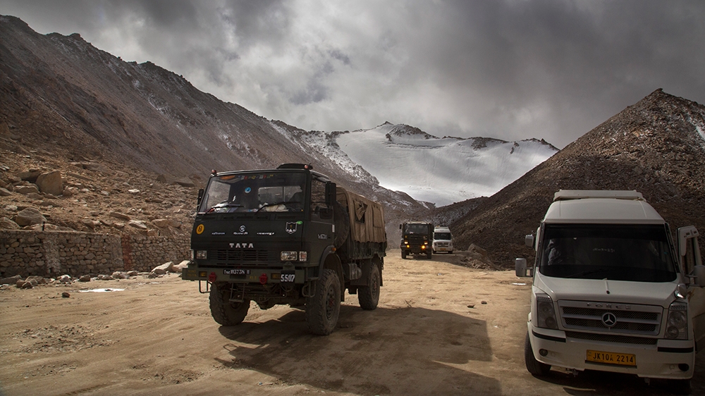 In this Sept. 14, 2018, photo, an Indian Army truck crosses Chang la pass near Pangong Lake in Ladakh region, India. Indian and Chinese soldiers are in a bitter standoff in the remote and picturesque 