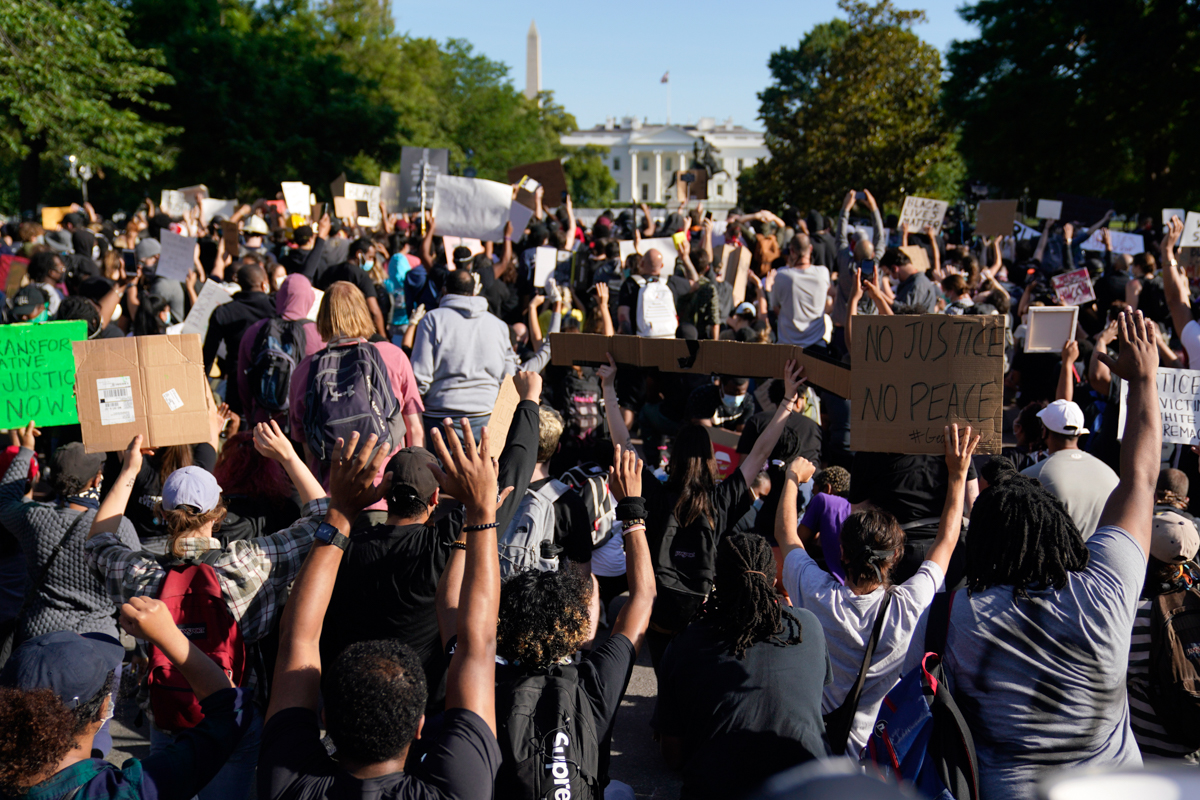 Demonstrators gather to protest the death of George Floyd, Monday, June 1, 2020, near the White House in Washington. Floyd died after being restrained by Minneapolis police officers. (AP Photo/Evan Vu