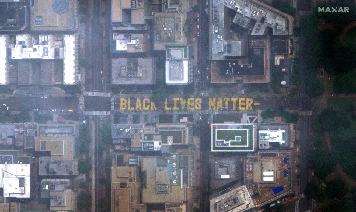 epa08470331 A photo made available by MAXAR Technologies shows a satellite image of ''Black Lives Matter'' painted on the pavement of 16th Street near the White House (not pictured), the location of eig