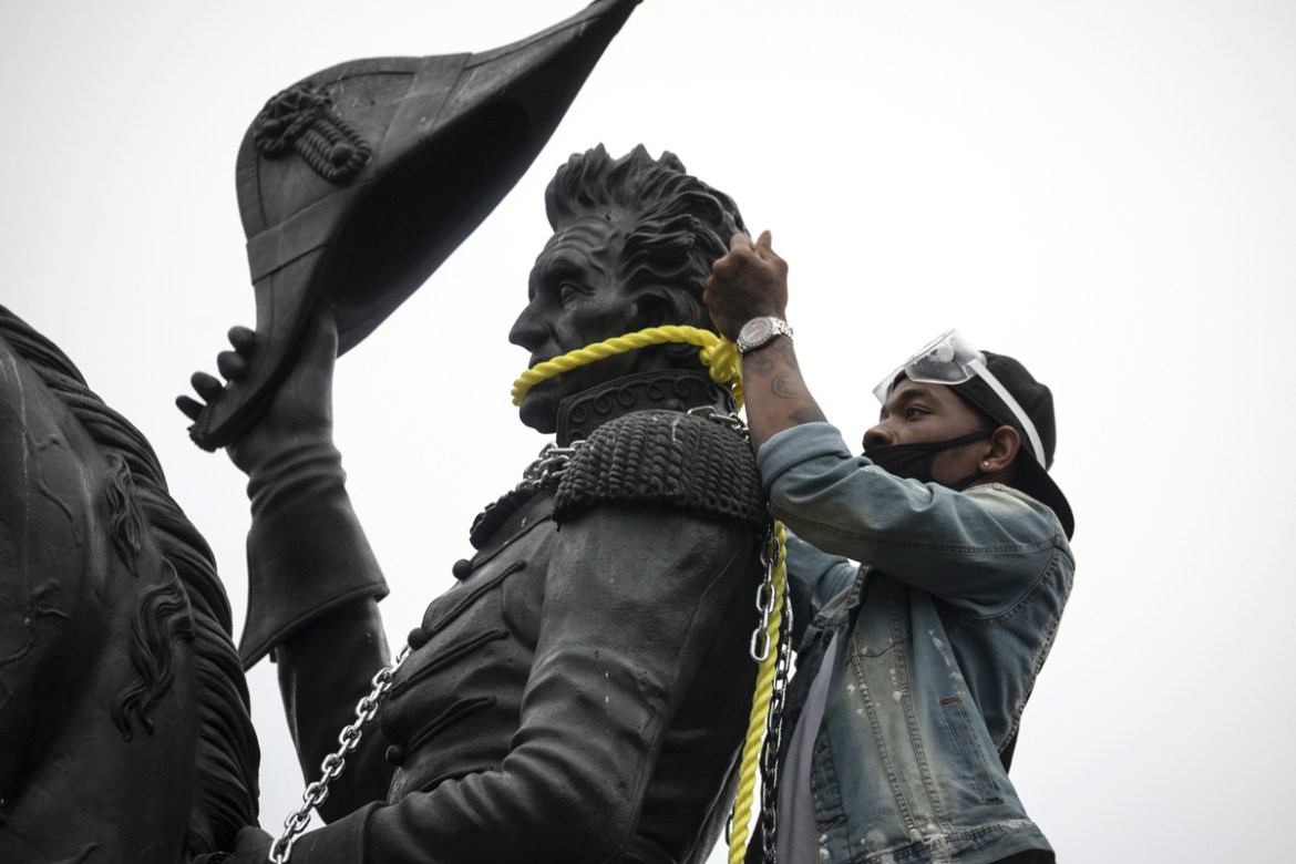 WASHINGTON, DC - JUNE 22: Protesters attempt to pull down the statue of Andrew Jackson in Lafayette Square near the White House on June 22, 2020 in Washington, DC. Protests continue around the country