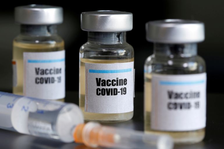 Small bottles labeled with a "Vaccine COVID-19" sticker and a medical syringe are seen in this illustration taken taken April 10, 2020. REUTERS/Dado Ruvic/File Photo
