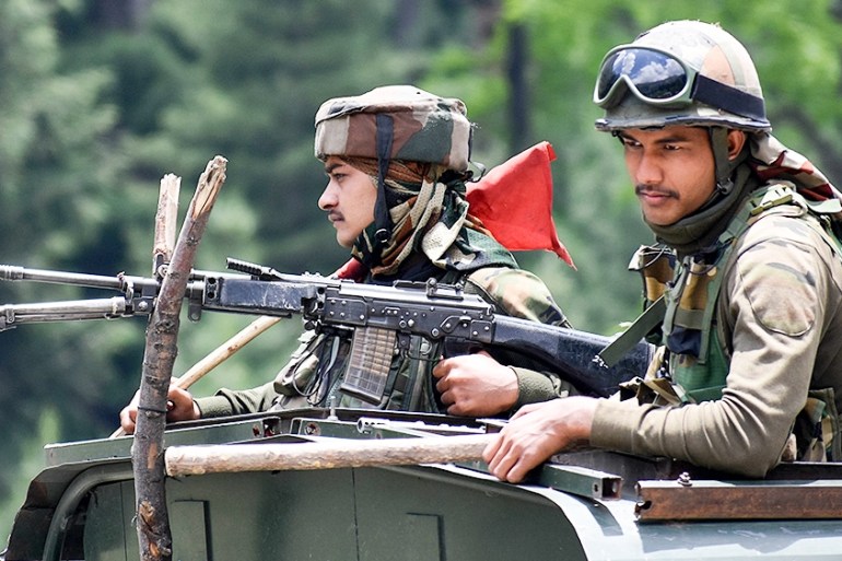 KASHMIR, INDIA-JUNE 17: Indian army soldiers on top a military vehilce move along the Srinagar-Leh National highway on June 17, 2020.At least 20 Indian soldiers were killed in a violent clash with Chi