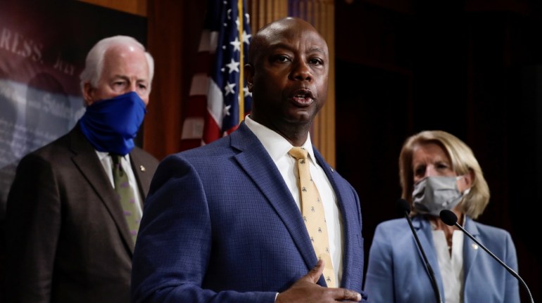U.S. Senator Tim Scott (R-SC) is flanked by Senators Shelley Moore Capito (R-WV) and John Cornyn (R-TX) as he speaks about his new police reform bill unveiled by Senate Republicans during a news confe