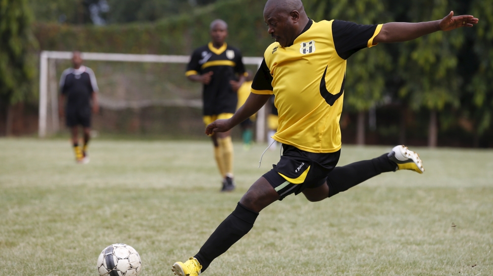 Nkurunziza kicks the ball during a soccer game with his friends in Bujumbura