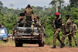 Ivory Coast soldiers patrol near the village of Saho where UN soldiers were killed a week earlier, following an attack in the southwest, close to the border with Liberia near Para. Seven Niger troops,