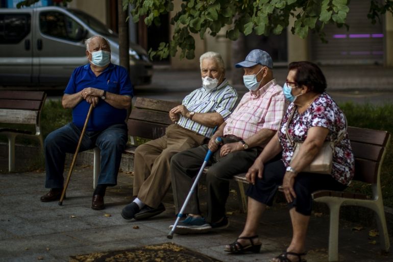 Elder people wearing face masks sit on a bench in a square in Barcelona, Spain, Sunday, May 31, 2020. Spanish Prime Minister Pedro SÃ¡nchez says he will ask Spain''s Parliament for a final two-week ext