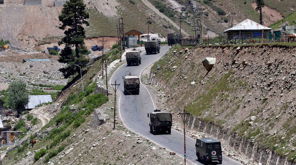 An Indian army convoy moves along Srinagar-Leh national highway, at Gagangeer, in east Kashmir's Ganderbal district, June 15, 2020. REUTERS/Danish Ismail