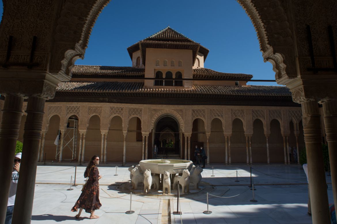 Tourists visit the Court of the Lions (Patio de los Leones) at the Alhambra in Granada on June 17, 2020, on the day it reopens to the public after three months of closure due to the coronavirus pandem
