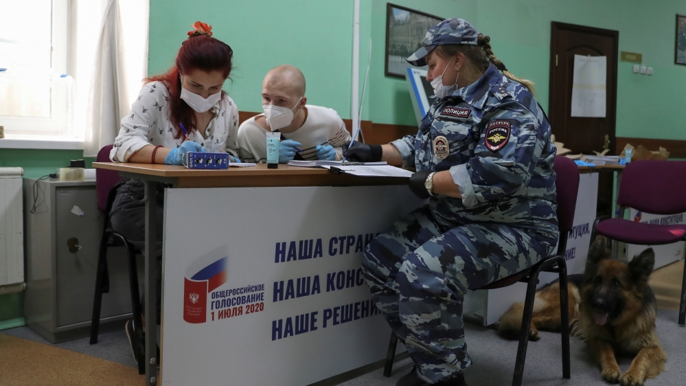 Members of a local electoral commission take part in preparations for the upcoming nationwide vote on constitutional reforms in Moscow