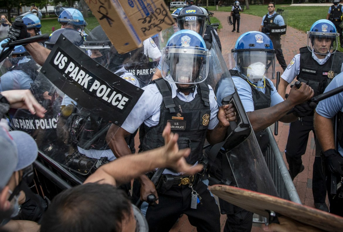 WASHINGTON, DC - JUNE 22: (EDITOR''S NOTE: Image contains profanity.) Protesters clash with U.S. Park Police after protesters attempted to pull down the statue of Andrew Jackson in Lafayette Square nea