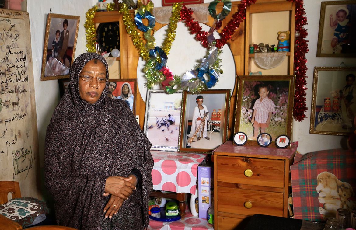 Sudanese Amna Abdulsalam, the mother of late youth protester Abdulsalam, stands in front of a memorial for her son, on June 2, 2020 in Khartoum on the eve of a raid where at least 128 people were kill