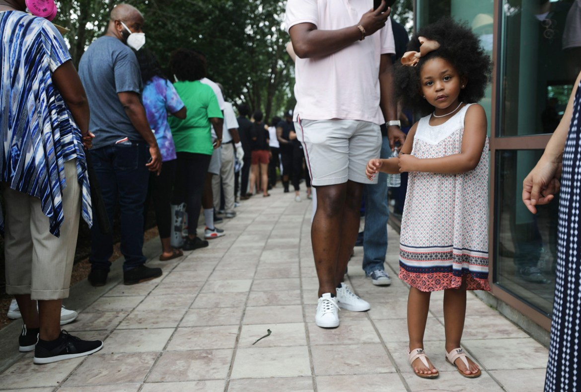 HOUSTON, TEXAS - JUNE 08: People wait in line to attend the public viewing for George Floyd outside the Fountain of Praise church on June 8, 2020 in Houston, Texas. George Floyd died on May 25th when