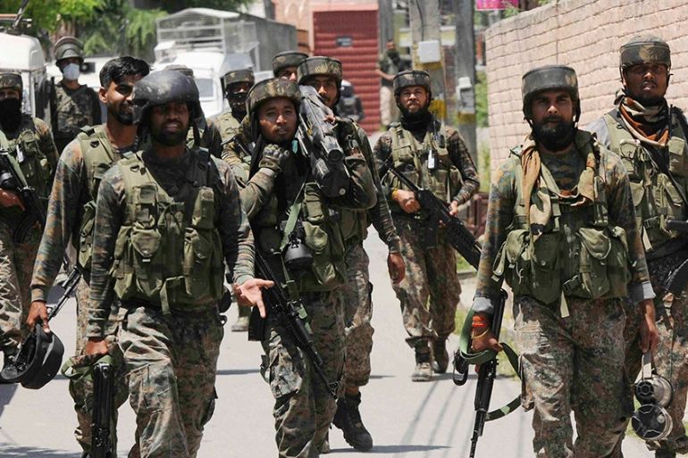 epa08499937 Indian army soldiers return from the site of a gunfight with separatist militants in Srinagar, the summer capital of the union territory of Jammu and Kashmir, 21 June 2020. Three militants