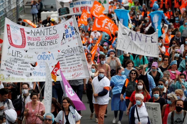 French health workers attend a protest in Nantes