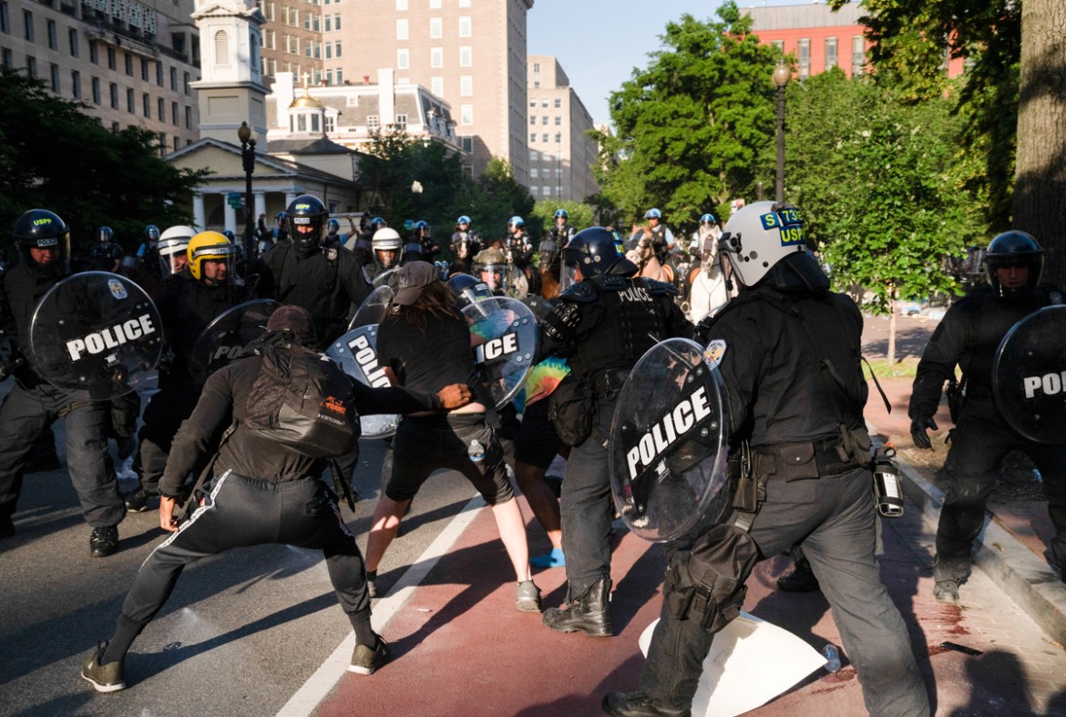 Riot police rush protestors to clear Lafayette Park and the area around it across from the White House for President Donald Trump to be able to walk through for a photo opportunity in front of St. Joh