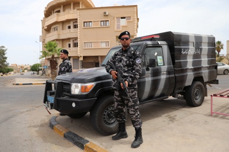 A member of security forces loyal to Libya''s internationally recognised government holds his weapon during a security deployment in Tarhouna city