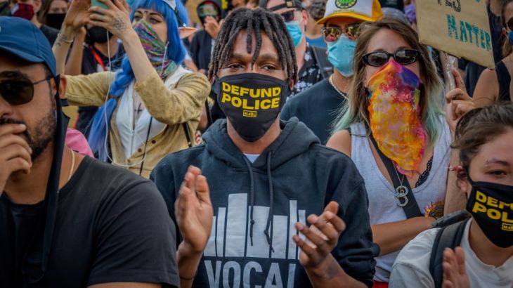 BROOKLYN, NEW YORK, UNITED STATES - 2020/06/07: A participant wearing a face mask with the words Defund Police in it. Thousands of protesters gathered at Mc Carren Park in Brooklyn for a massive march