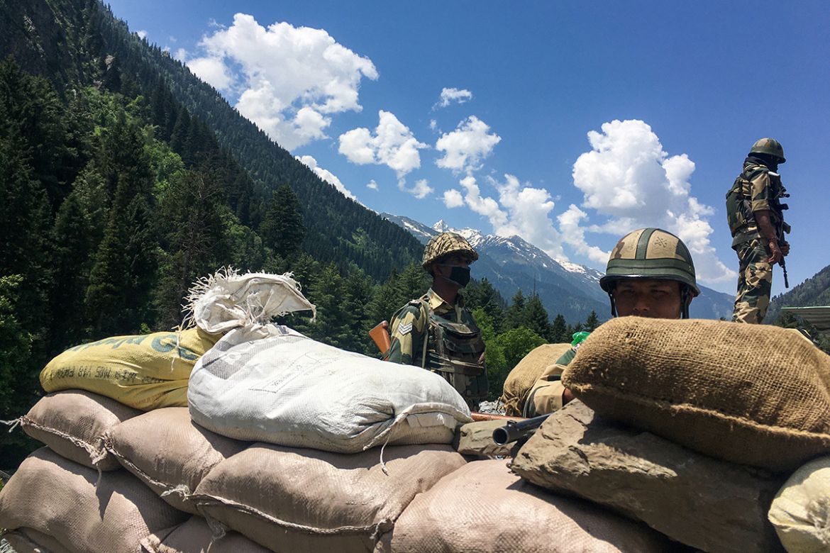 Indian Border Security Force (BSF) soldiers guard highway leading towards Leh, bordering China, in Gagangir on June 17, 2020. - The long-running border dispute between Asian nuclear powers India and